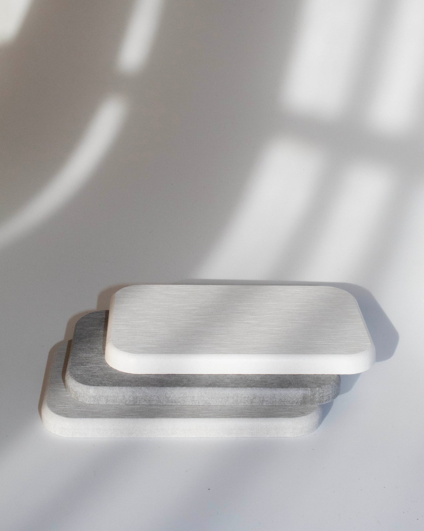 Textured diatomaceous diatomite absorbent bathroom counter coaster in grey and white