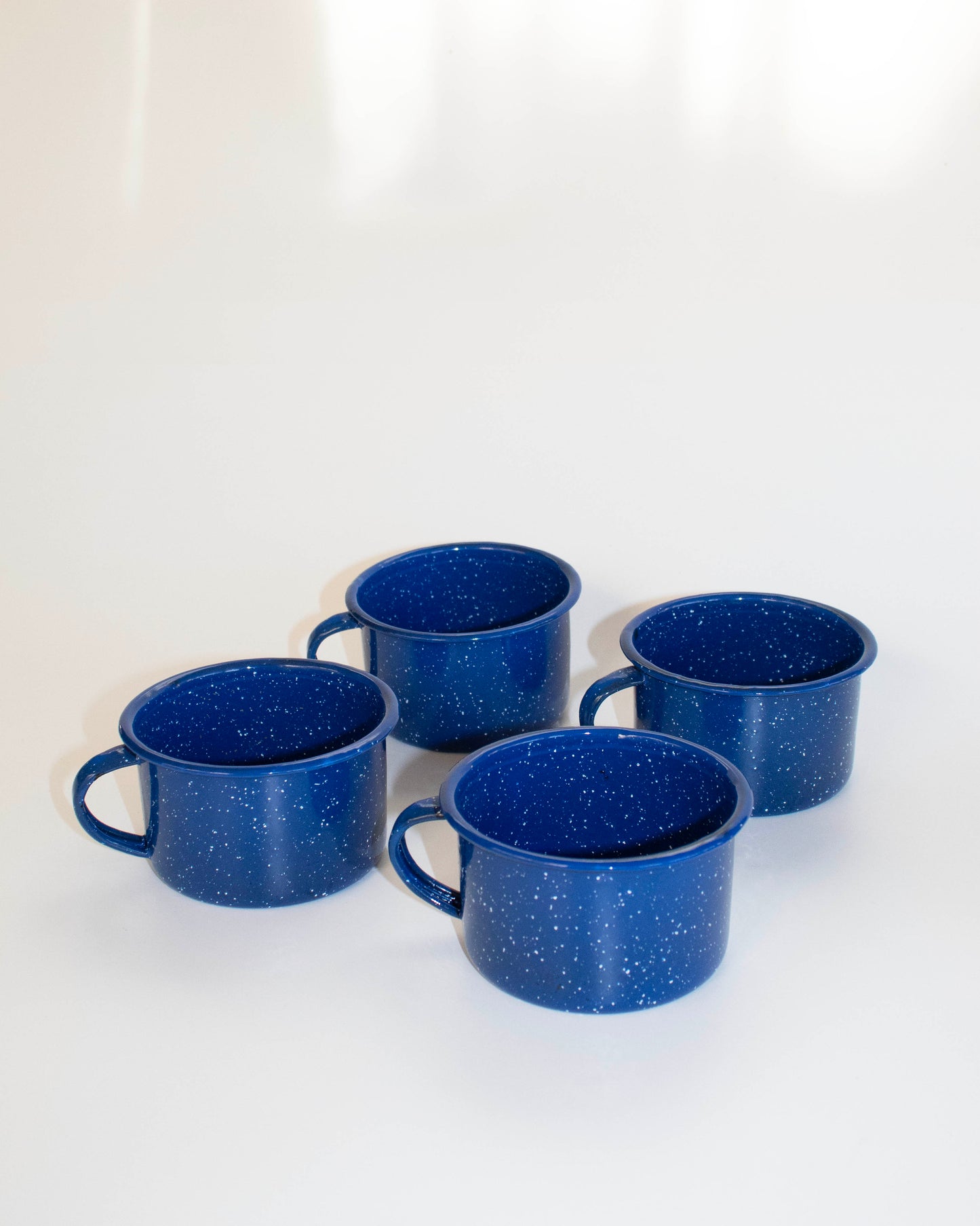 Durable enamel-plated mug with a glossy finish, perfect for camping and daily use