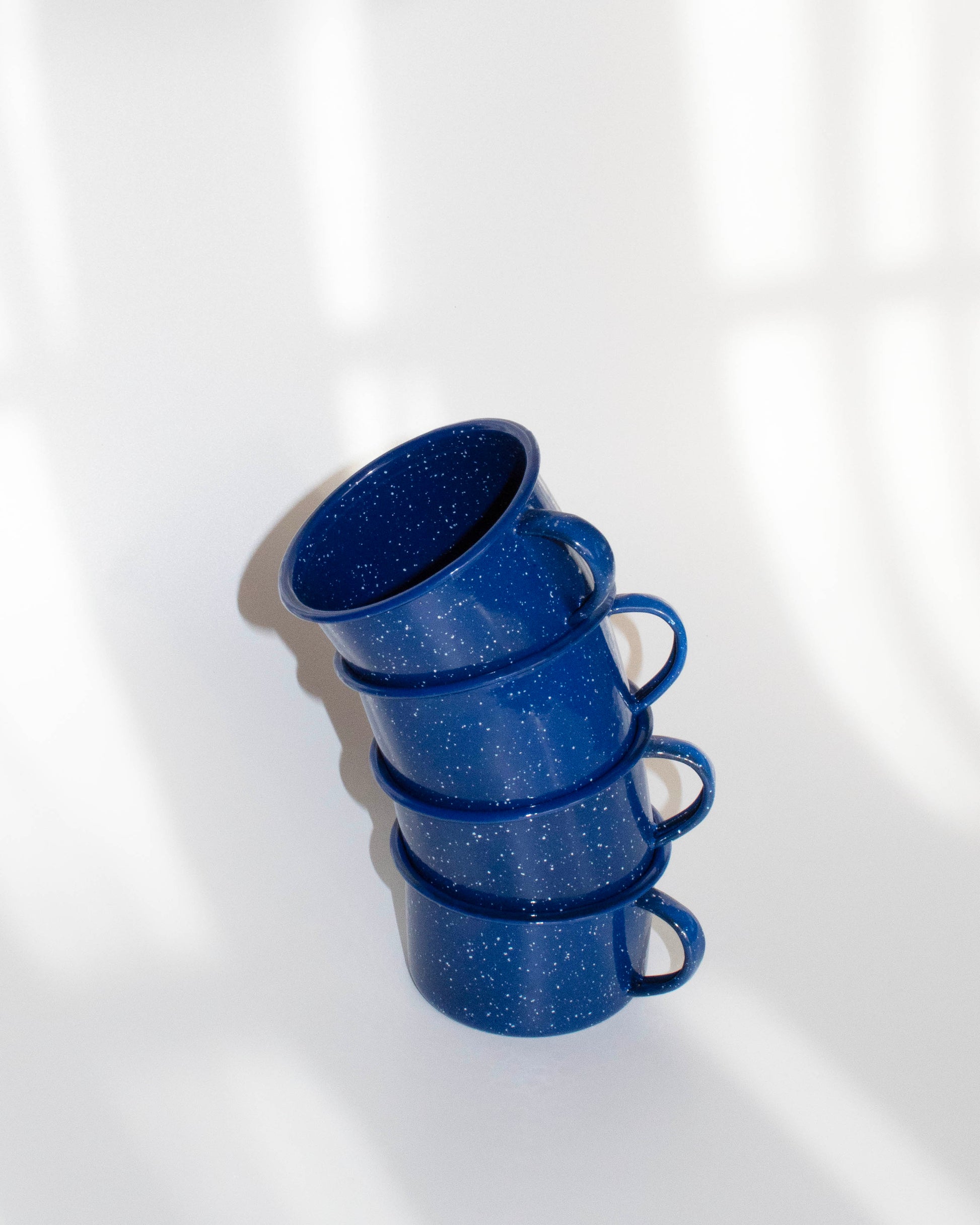 Durable enamel-plated mug with a glossy finish, perfect for camping and daily use