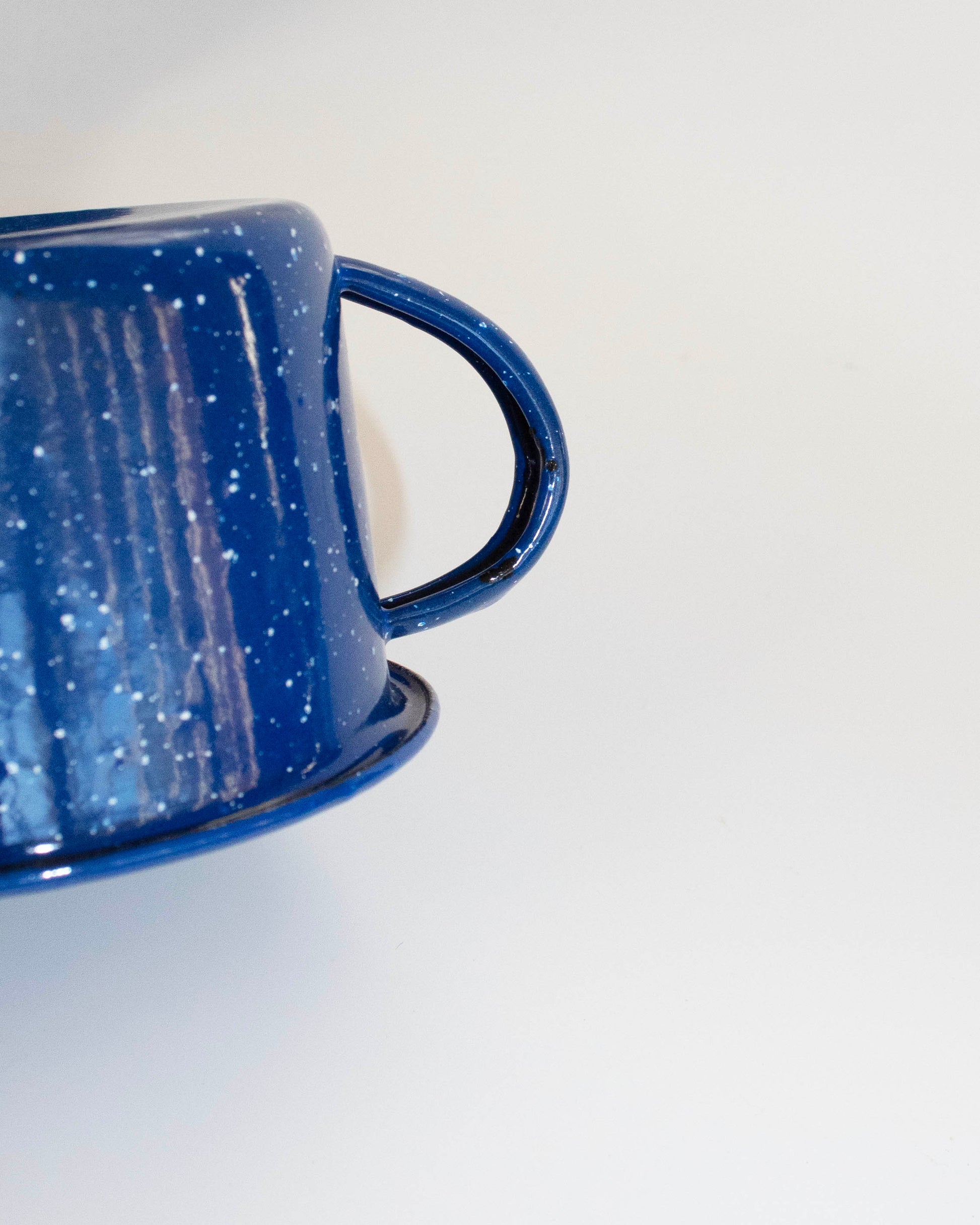 Durable enamel-plated mug with a glossy finish, perfect for camping and daily use